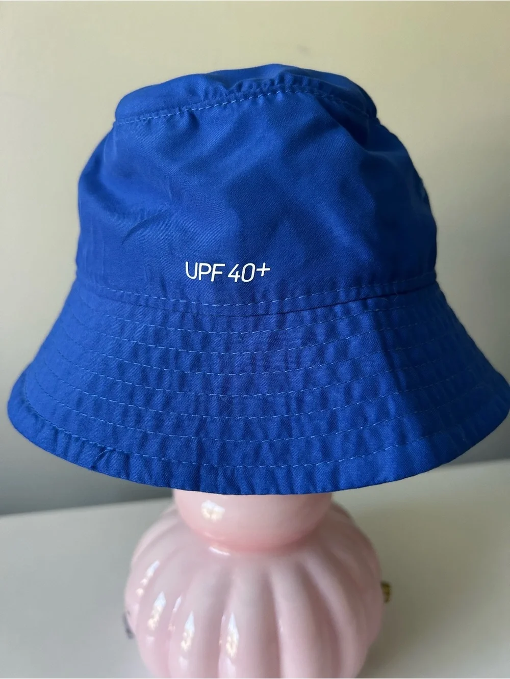 Infant blue Nike bucket hat with Velcro neck strap UPF 40+